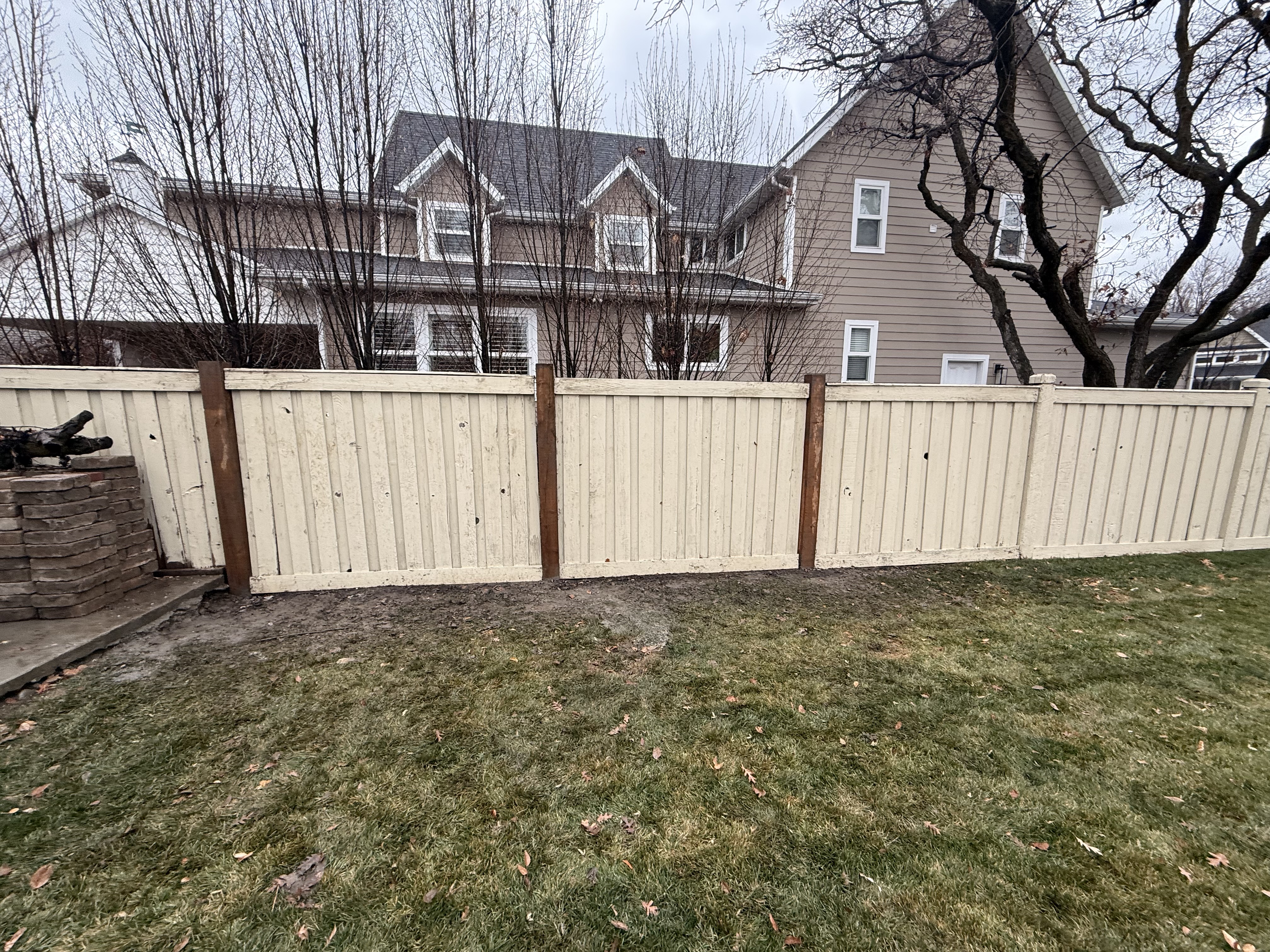 Three fence posts repaired in Provo Utah area with matching posts securely installed.