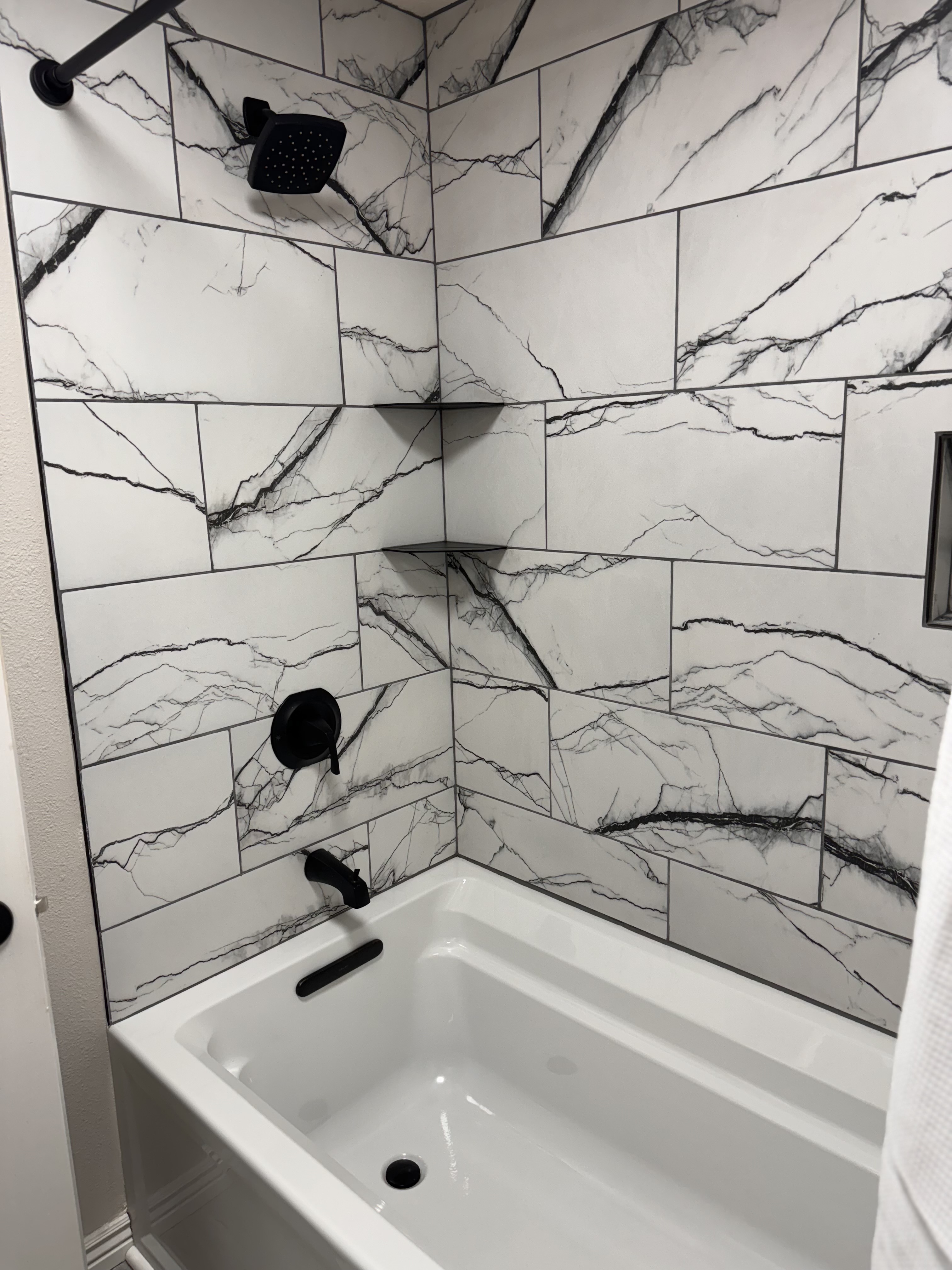 Guest Bathroom Remodel with bold black tile